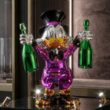 Billionaire Duck Dekoratif Ördek Biblo – Mor 40 cm, iki yeşil şampanya şişesi ve parlak emaye kaplamasıyla.